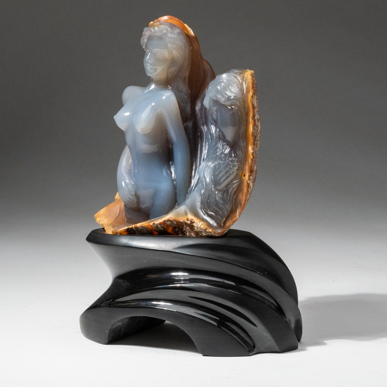 Polished Hand Carved Imperial Blue-Gray Chalcedony Bust and Profile on a Custom Obsidian Base