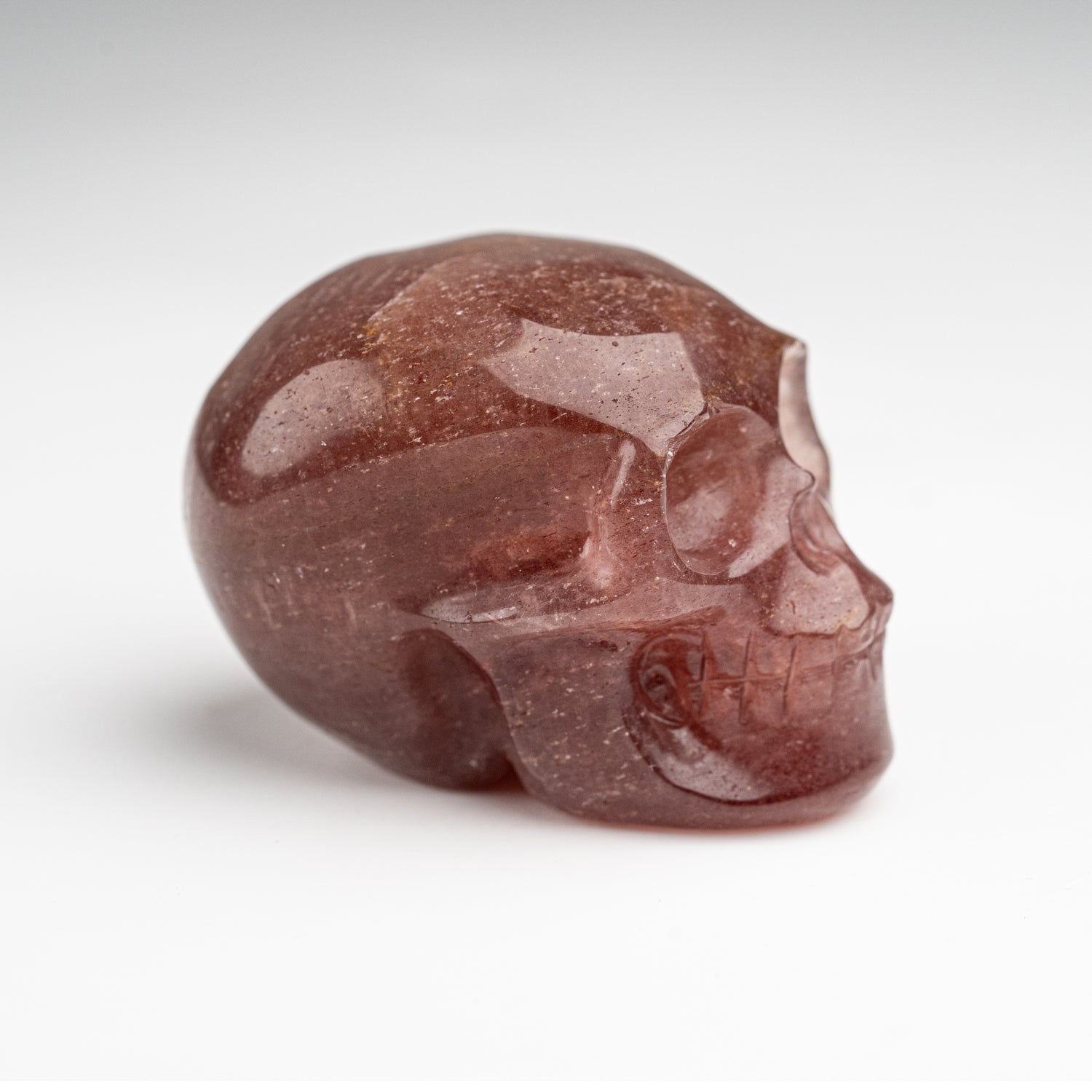 Polished Strawberry Quartz Skull Carving (125.4 grams)