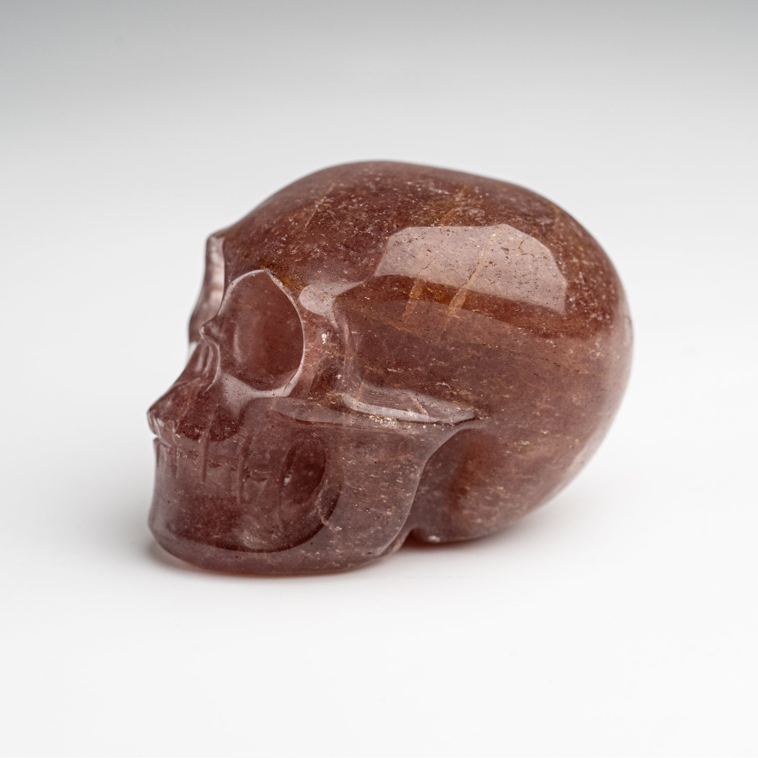 Polished Strawberry Quartz Skull Carving (125.4 grams)