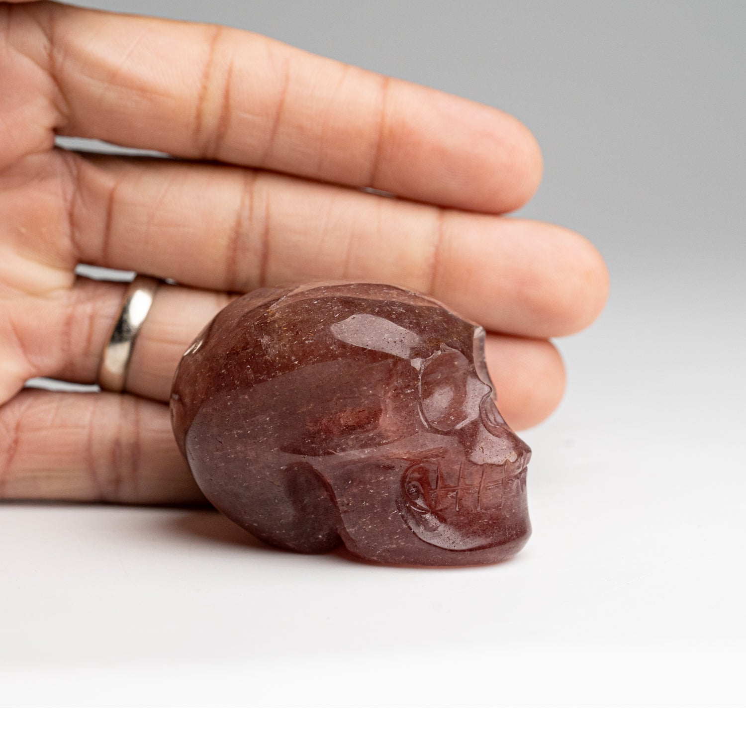 Polished Strawberry Quartz Skull Carving (125.4 grams)