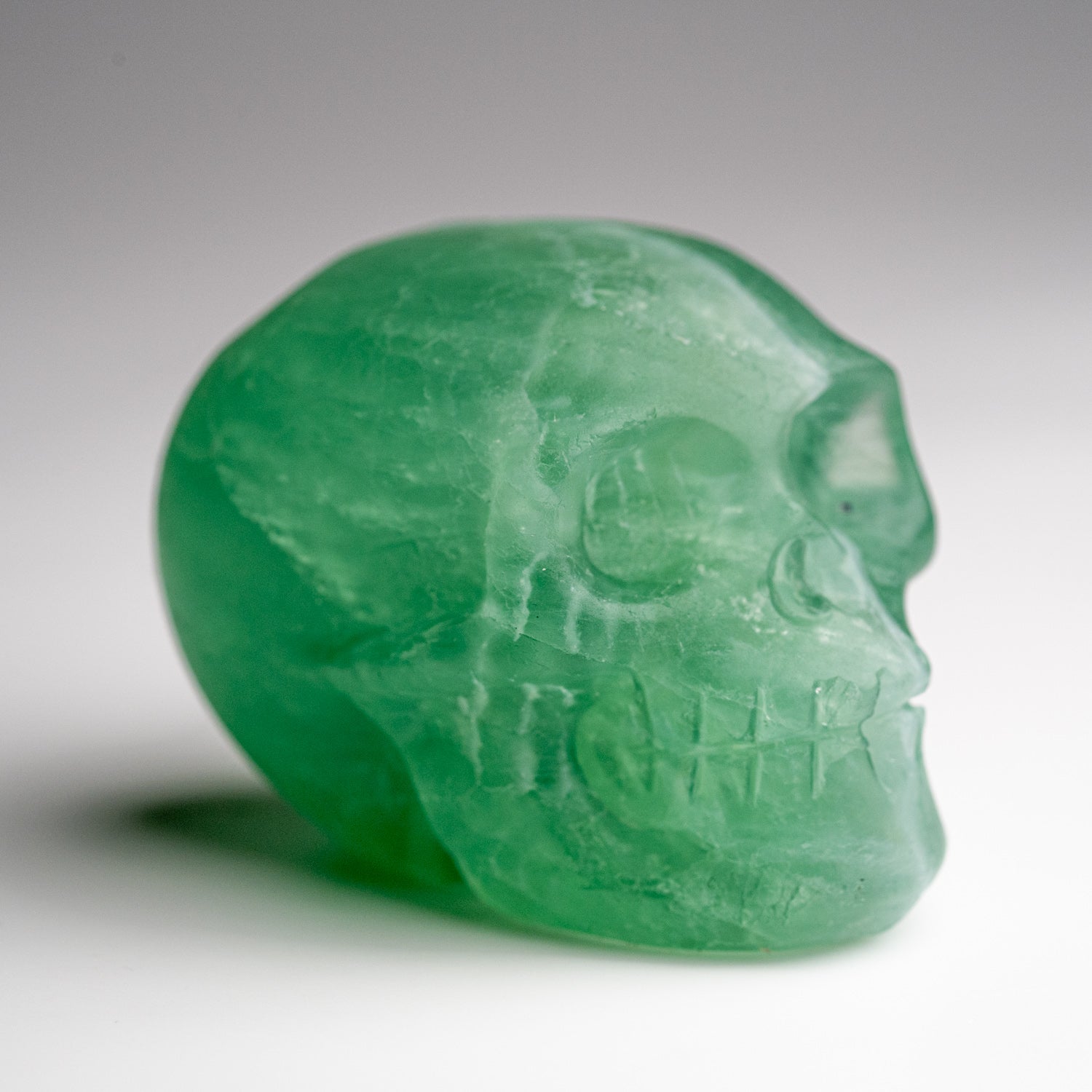 Polished Green Fluorite Skull Carving (168.6 grams)