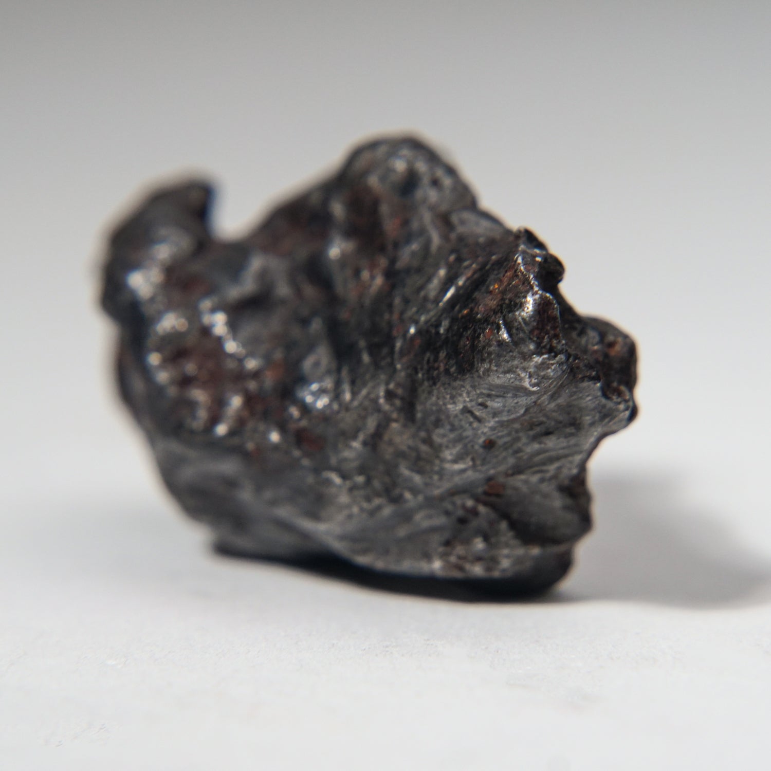 Genuine Sikhote-Alin Meteorite on Acrylic Stand (99.5 grams)