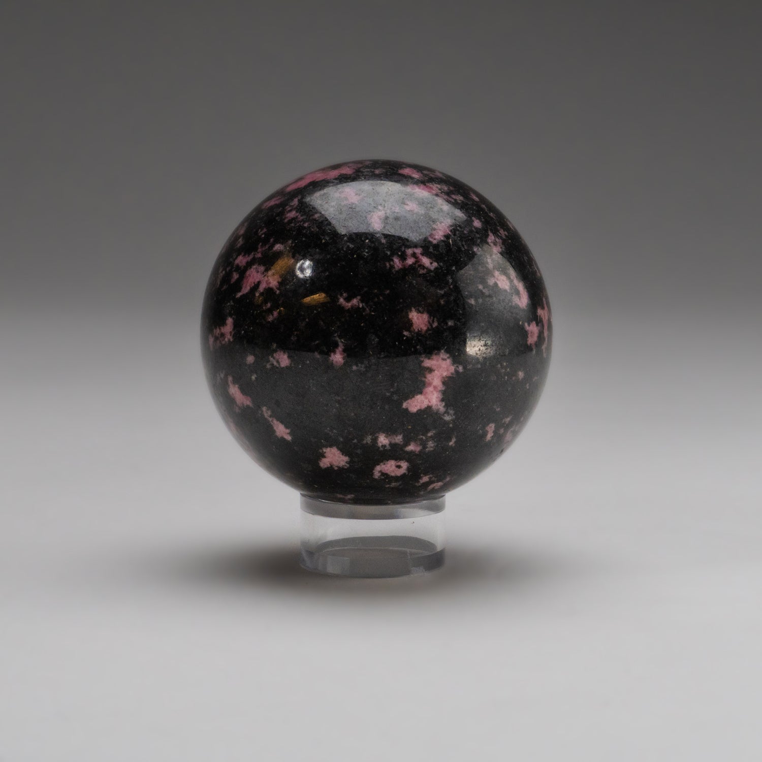 Polished Imperial Rhodonite Sphere from Madagascar (1.2 lbs)